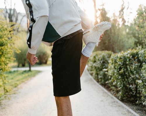 A person stretching outdoors showing active lifestyle